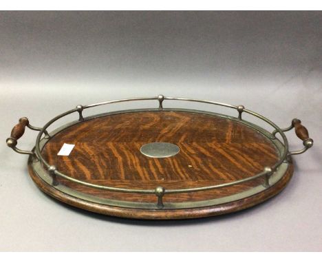 OAK AND SILVER PLATED SERVING TRAY AND A MECHANICAL WINE DECANTING CRADLE  the oval tray with twin handlesQty: 2