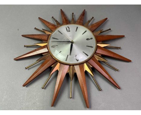 VINTAGE METAMIC TEAK STARBUST WALL CLOCK AND TWO OTHERS  the other clocks also starburstQty: 3We are unable to confirm if the