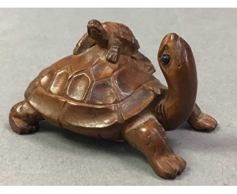 COLLECTION OF CARVED WOOD AND TAGUA NUT NETSUKE 20TH CENTURY  including a tiger, dragon, foot and tortoiseQty: 8