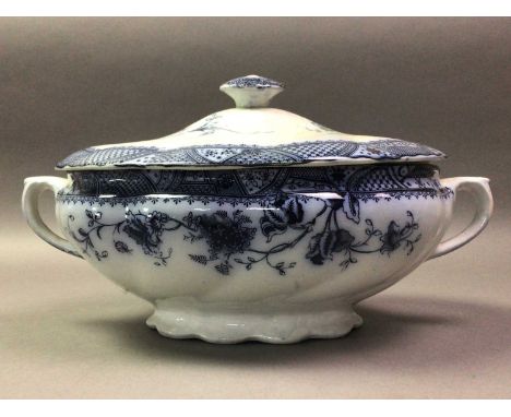 GROUP OF BLUE AND WHITE CERAMICS including ashets, lidded tureens, jugs, bowls, tea pot and wall clock
