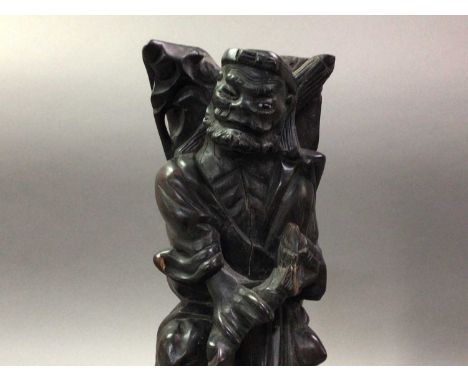 TWO DECORATIVE HARDWOOD FIGURES AND CERAMIC FIGURES one hardwood figure holding a stick, along with a similar example, comple