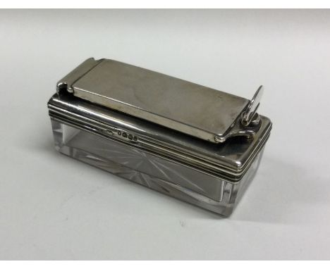 An unusual Victorian silver mounted travelling inkwell with hinged lid. London. Est. £70 - £80.