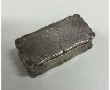 A heavy cast Continental silver snuff box decorated with scrolls and flowers. Approx. 80 grams. Est. £100 - £150.