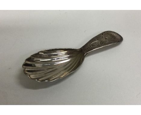 A Georgian silver bright cut caddy spoon. London. Approx. 8 grams. Est. £30 - £50.