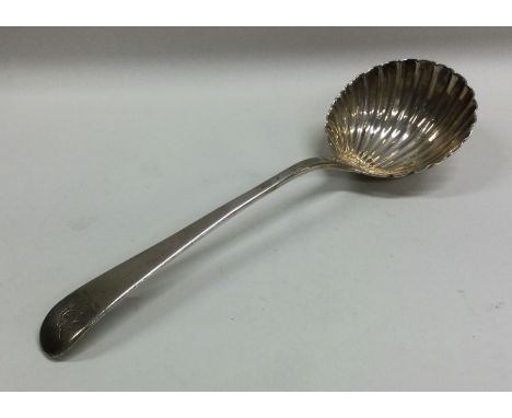 A Georgian OE pattern silver ladle with fluted bowl. Approx. 50 grams. Est. £30 - £50.