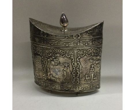 A good boat shaped embossed silver tea caddy profusely decorated with figures and scrolls. Marked to base. Bearing import mar