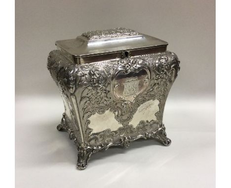 GLASGOW: A good Victorian Scottish silver tea caddy chased with flowers and leaves of Rococo design. 1859. By J Muirhead &amp