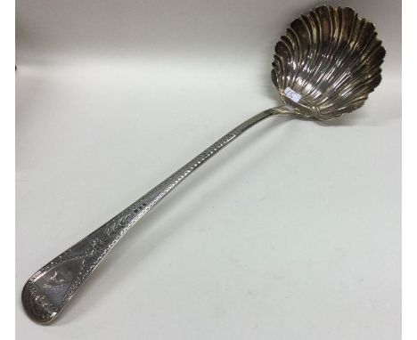 A heavy Georgian silver soup ladle with bright cut handle to fluted bowl. London. By Eley &amp; Fearn. Approx. 164 grams. Est