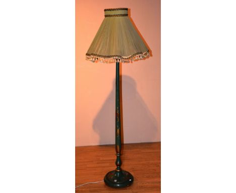 A green painted chinoiserie floor lamp with shade, decorated with figures and foliate panels, converted to electricity, 191cm