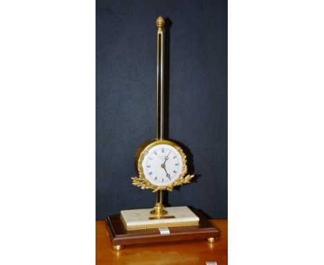 A limited edition brass and marble gravity rack clock by Thwaites & Reed Clerkenwell London, with acorn mounted brass rack ab