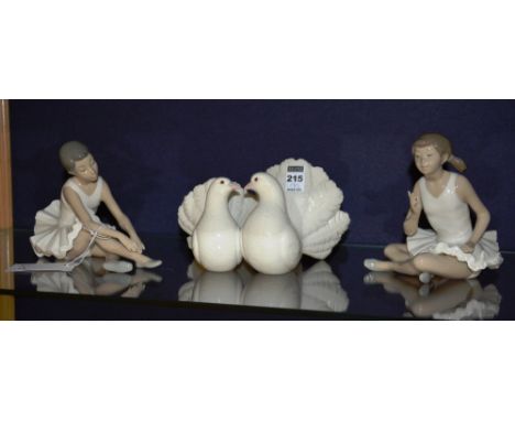 A Lladro dove figure group, 11cm high, together with two Nao ballerina figures, 16cm high (3)