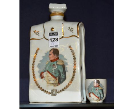 A Limoges cognac porcelain decanter, with stopper, depicting image of Napoleon Bonaparte, 21cm high, also with matching cup (