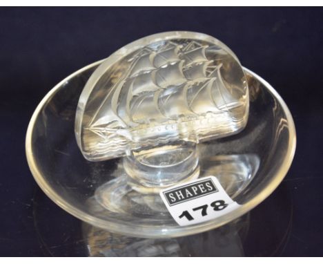 A Rene Lalique glass ships adorned pin dish, marked R Lalique France to base, 9.5cm diameter
