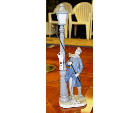 A Lladro figure group, of a man standing next to a street lamp, 47cm high