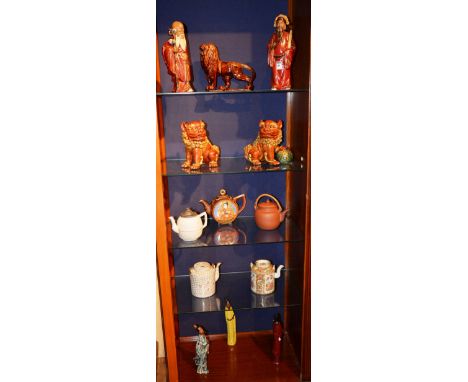 A quantity of Oriental pottery, to include a Canton Famille rose teapot, a pair of temple dog figures, a teracotta teapot and