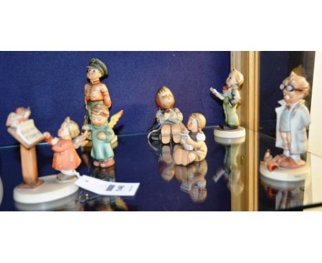 Seven Hummel figures by Goebel, comprising of 'Soldier Boy', 'Doctor', 'Bird Duet', 'Girl Singing Hymn', 'Angel Boy', 'Girl w
