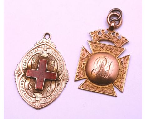 Two 9ct gold medals, one with red enamel cross to front, inscribed 'Caledonian Railway Ambulance Competition', and to reverse