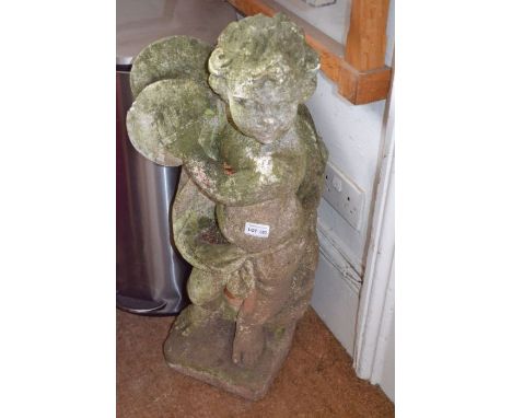 A cast concrete statue of a Putti clashing cymbals