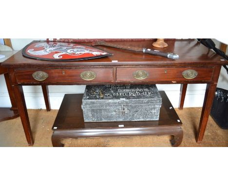 A late 19th early 20th century mahogany side table of large proportions two inline drawers