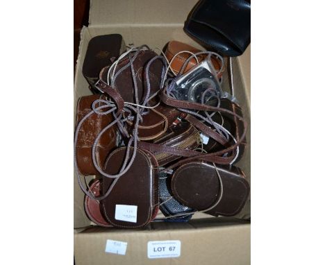 A box of vintage light meters