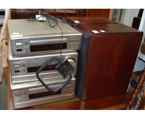 An Onkyo Hi-Fi system with speakers plus two speaker stands