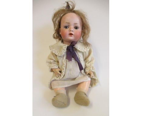 A Bahr & Proschild bisque socket head doll, with brown glass sleeping eyes, open mouth, teeth, light brown wig, composition b