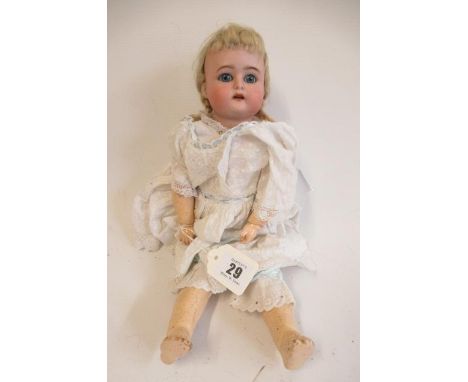 A Kammer & Reinhardt bisque socket head doll, with blue glass sleeping eyes, open mouth, applied top teeth, pierced ears, blo
