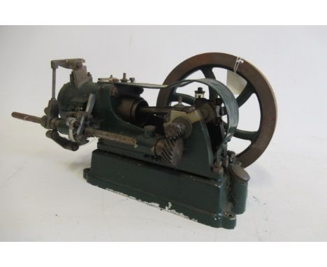 A single cylinder gas engine, rotary drive with single valve and spark ignition, some storage wear, 35cm x 30cm x 15cm, F-G