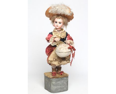 A Tete Jumeau automaton, with bisque head and hands, blue glass paperweight fixed eyes, mouth moulded slightly open, pierced 