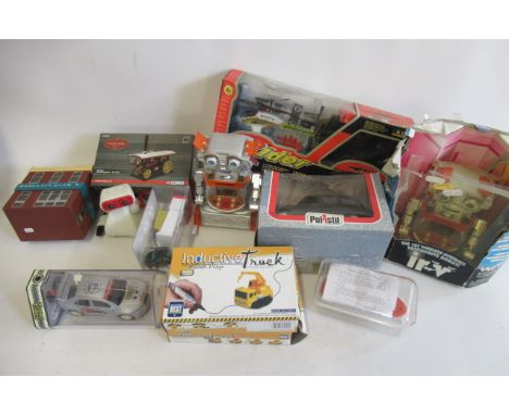 Late issue toys including battery cars, robot and helicopter, some items boxed, F-G