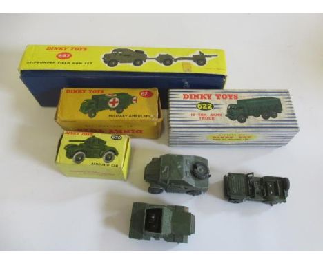 Dinky military vehicles 697 Fieldgun Set, 622 10 Ton army truck, 626 Ambulance and 678 Scout car, all items boxed, F, and thr