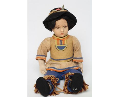 A pre-war Lenci boy doll, with felt head and arms, painted features, jointed body and original outfit, 14" longGenerally good
