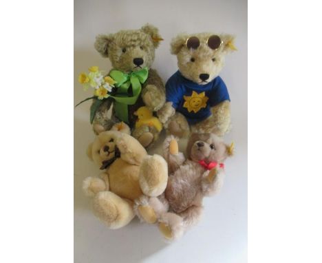 Four Steiff collector's teddies, comprising Sunny with certificate, Dylan with certificate, a grey and an light orange bearGo