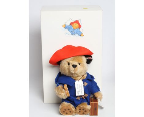 A boxed Steiff Paddington Bear, with blue coat, marmalade sandwich, suitcase and hatGood overall condition