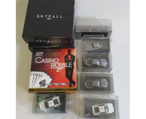 Corgi James Bond Royal Set with cards, six further James Bond cars by Fabbri and two Italian Skyfall helicopters, all items b