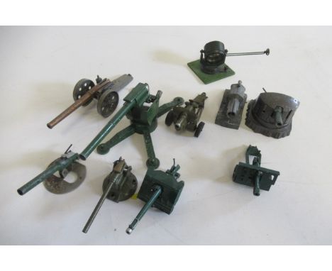 Nine field guns by various makers and an Astra Search Light on wooden base, F