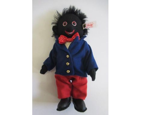 A boxed Steiff "Golly Boy", limited edition, in felt clothing and leather boots with ear button and tag, 10 1/2" highGood ove