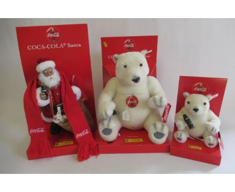 Three Steiff Coca-Cola edition bears, comprising a boxed Polar Bear Cub, a boxed Santa and a Polar BearGood overall condition