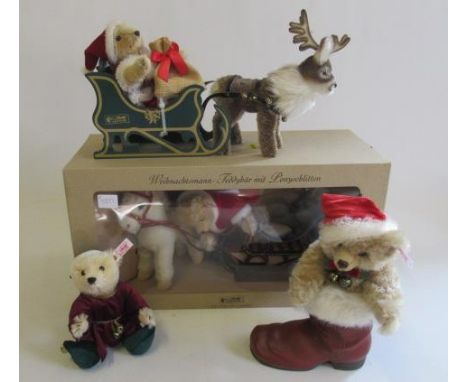 Four Christmas Steiff bears, comprising a boxed Father Christmas with Pony Sledge, a boxed teddy bear in a boot and two other