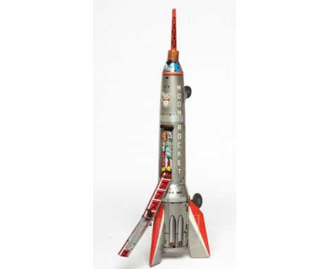 Masuya friction Moon Rocket, printed tinplate with ladder and astronaut, some age wear, friction motor in working order, circ