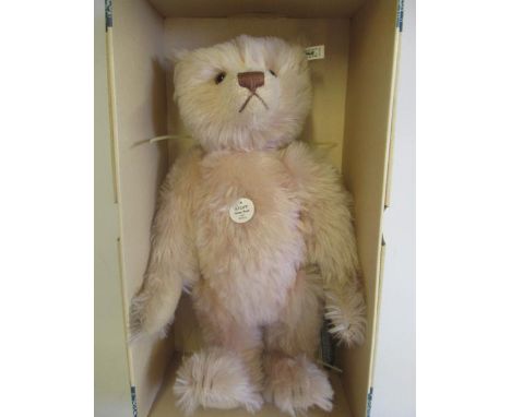 A boxed Steiff replica 1927 teddy Rose, with pink plush, growl, ear button, ear label and certificateGood condition