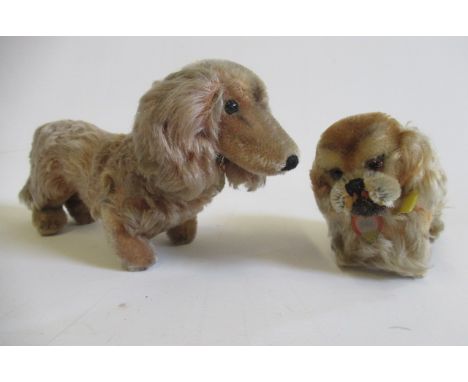 Three Steiff items, comprising a Peky with label, a Waldi with label and a later rabbit, all with ear buttons and ear tagsSom