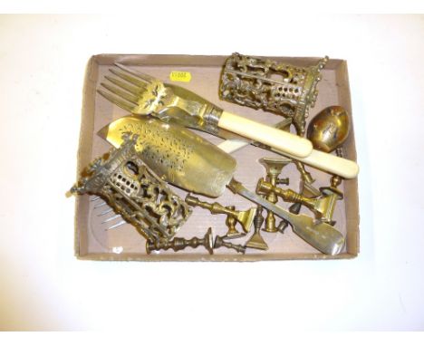 A tray containing miniature brass candlesticks; a fish serving knife and fork etc.