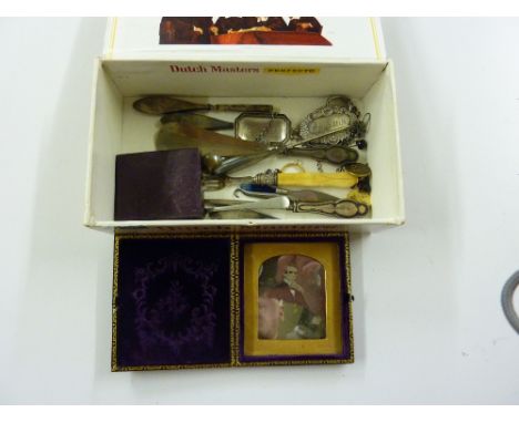 A box containing silver decanter labels; button hooks etc.