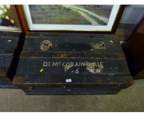 A wooden and metal lined trunk 