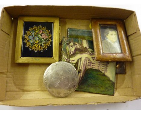 A tray containing a white metal compact; two enamel plaques etc.