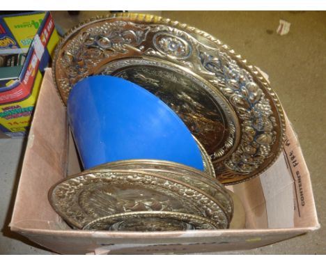 A box of various brass embossed trays; a firescreen and a blue light shade