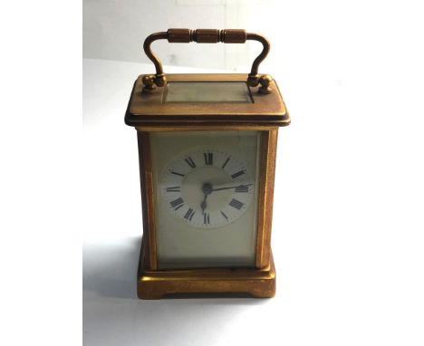Vintage  brass carriage clock winds and ticks but no warranty given no key 