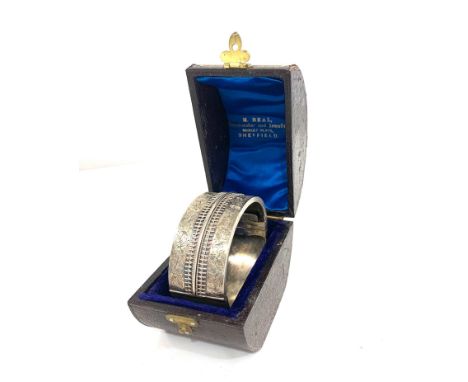 Antique boxed silver cuff bangle measures approx 25mm wide not hallmarked but tested as silver comes in original box 