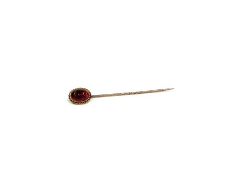 18ct gold cabachon garnet stick pin hallmarked 18 on back of head measures approx 62mm long 